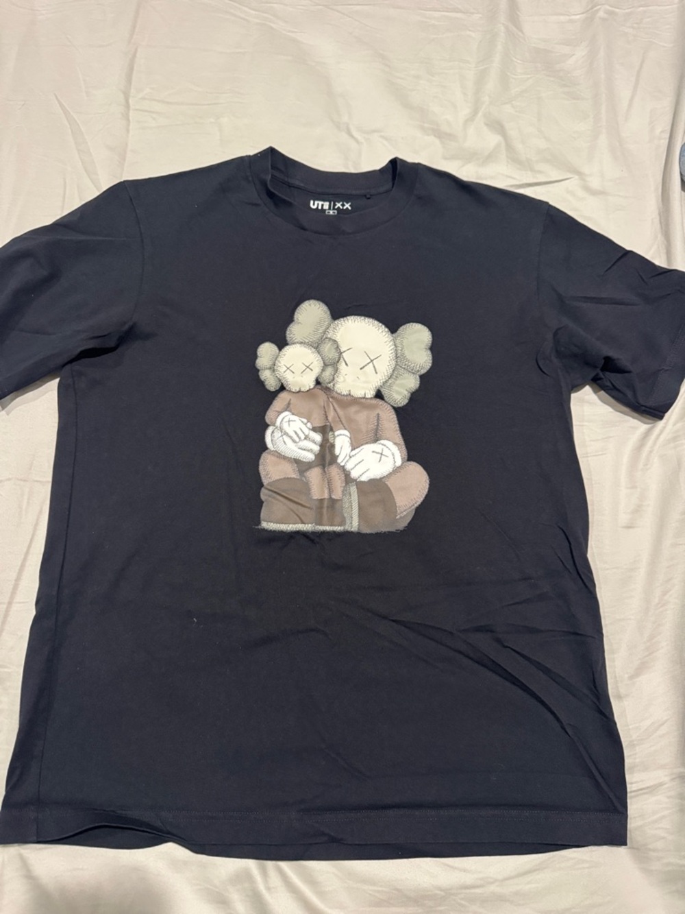 Uniqlo Black Short Sleeve Tee with KAWS Companion Graphic
